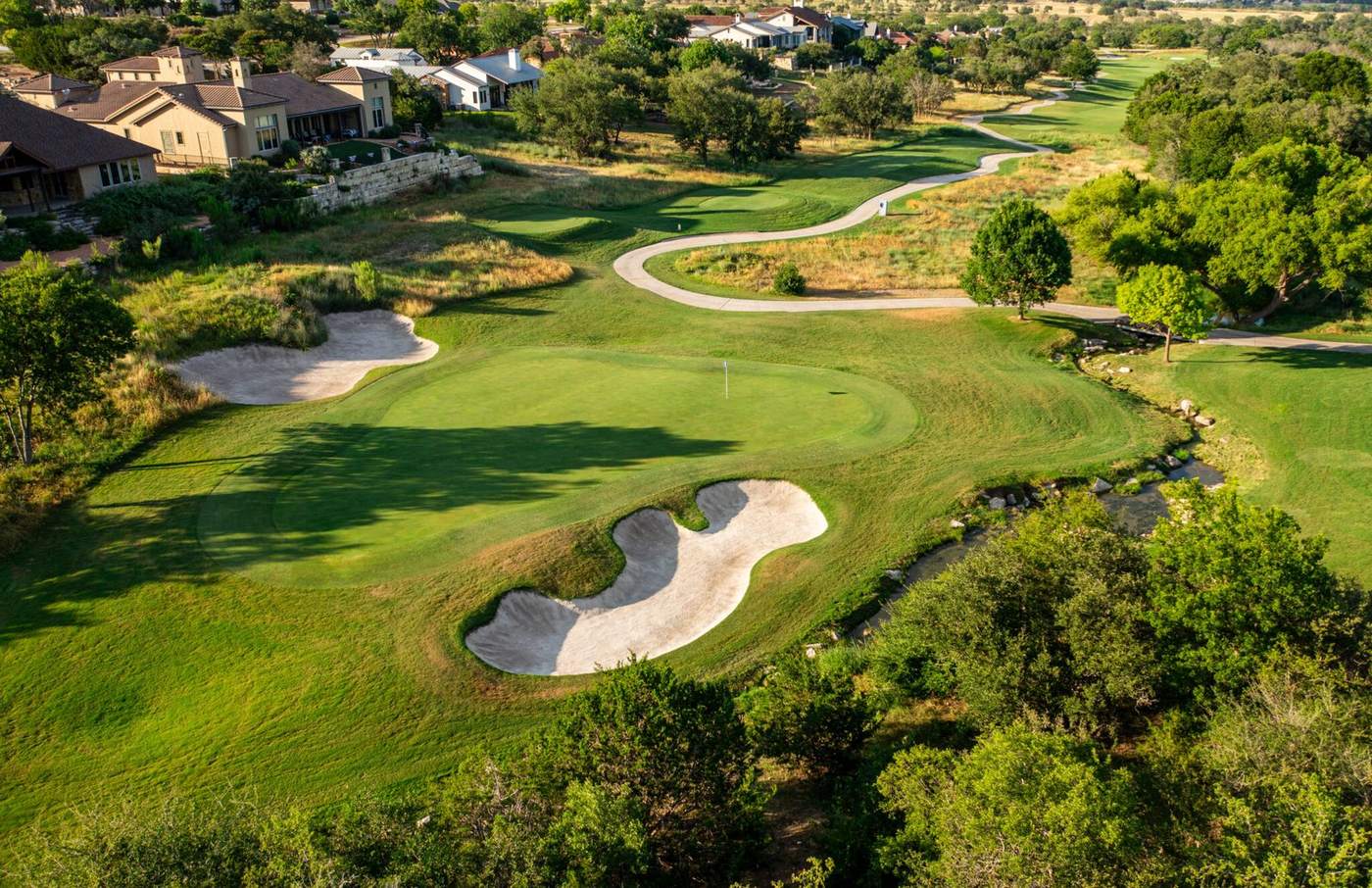Mown turf, bunker edges and cart paths kept up through the season.