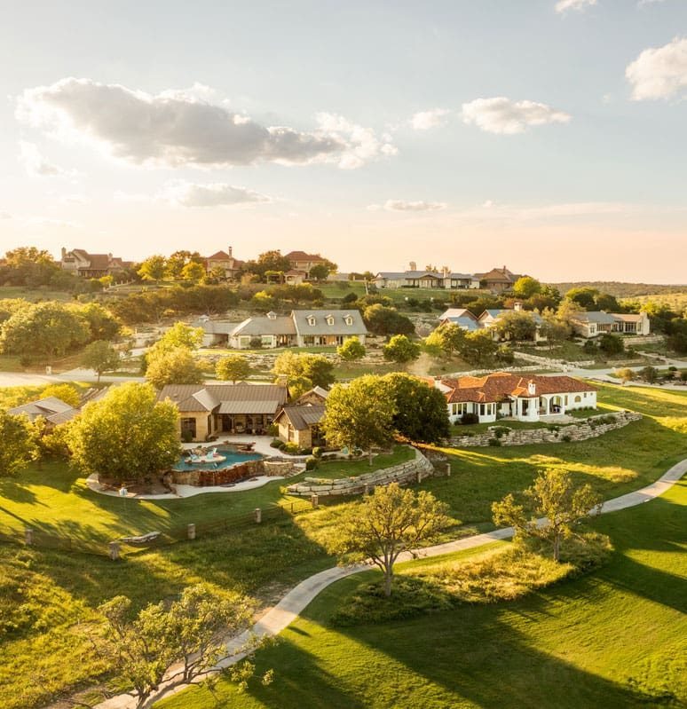 Landscaped grounds between the homes and the fairway.