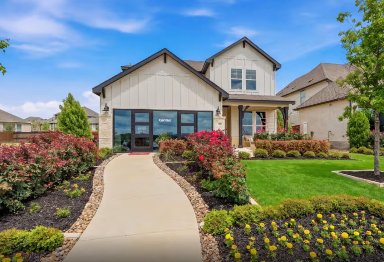 Entry walk with river rock borders and landscaping.
