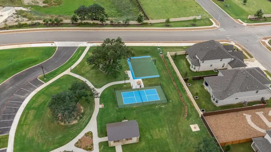 Courts and park, with retaining walls and mulched tree islands protecting the oaks.