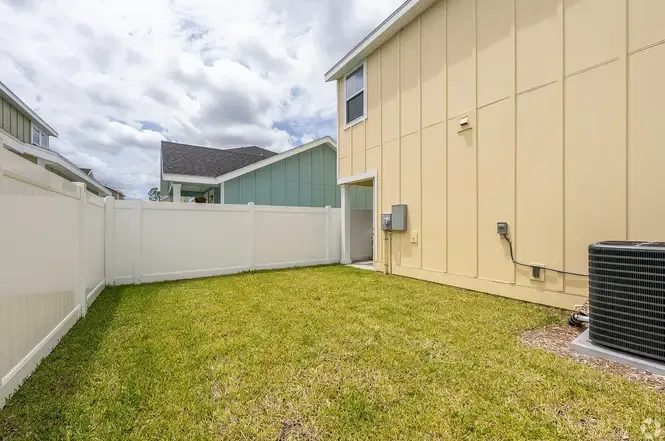 Fenced yard and sod at a completed home.
