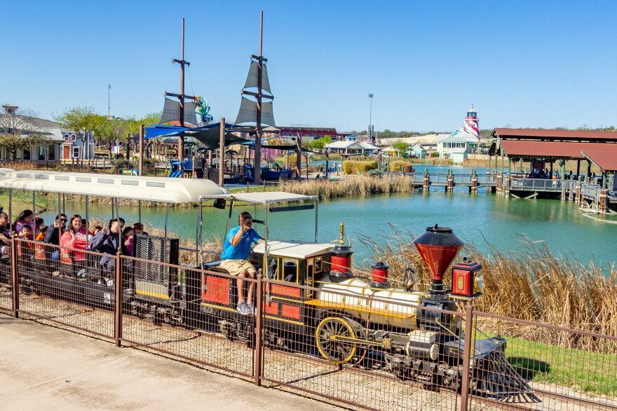The park train running past the completed waterfront.
