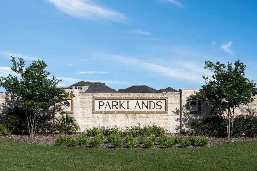 The Parklands entry monument, set in stone masonry and planting.