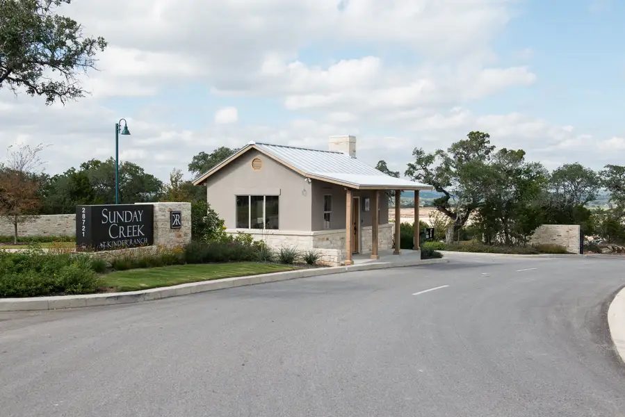 The gated entry and guard house off Kinder Ranch.