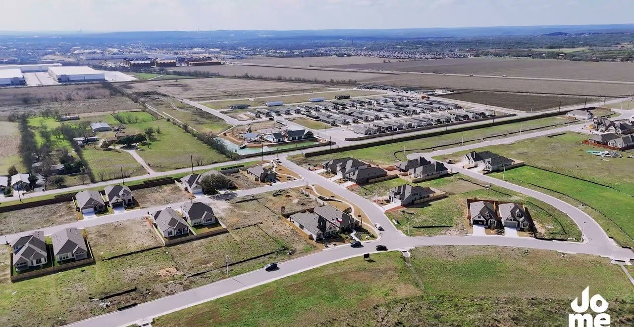 The section from above — streets, lots and graded pads kept clean and stabilized through build-out.