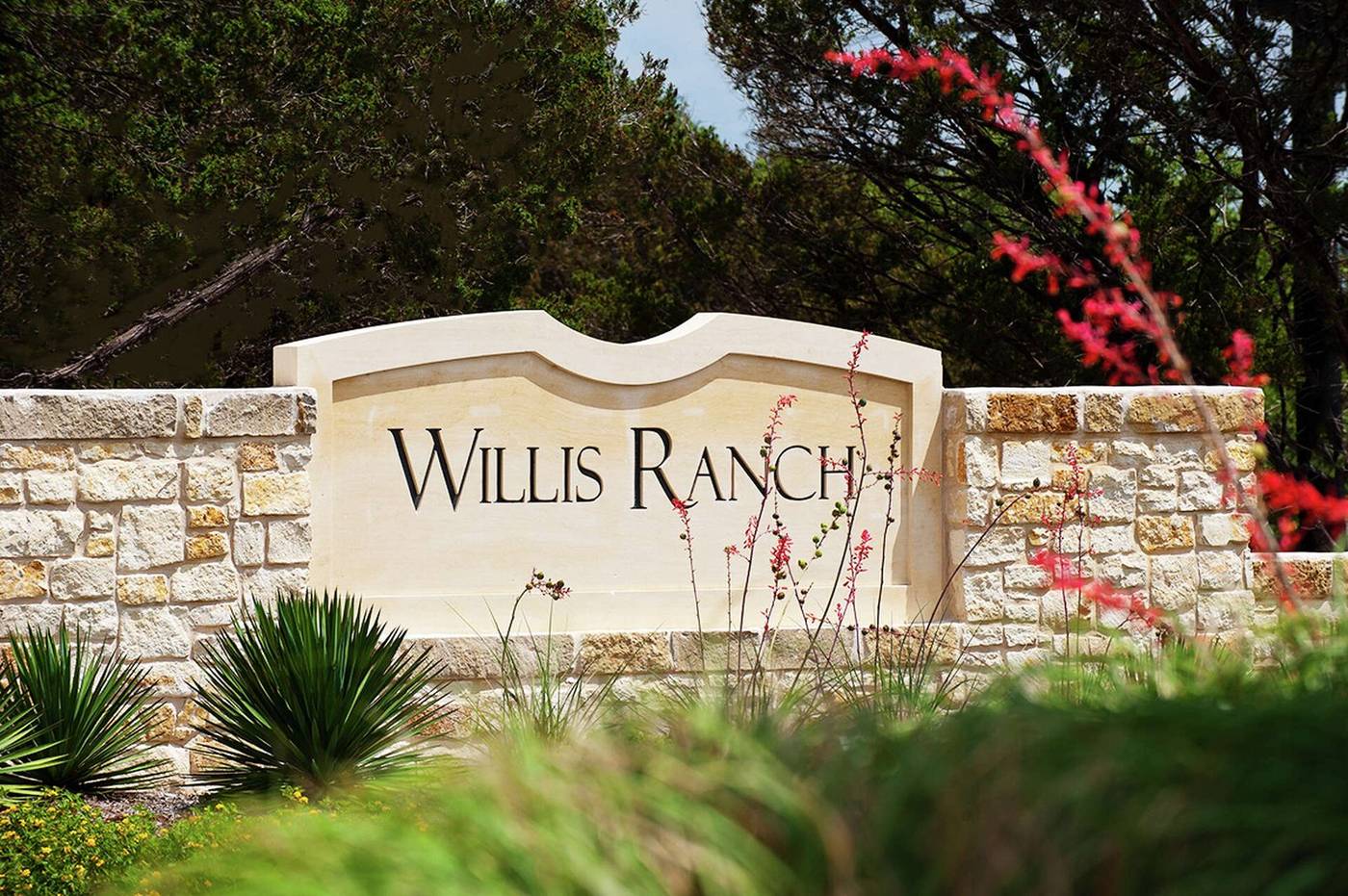 The Willis Ranch entry monument and stone wall.